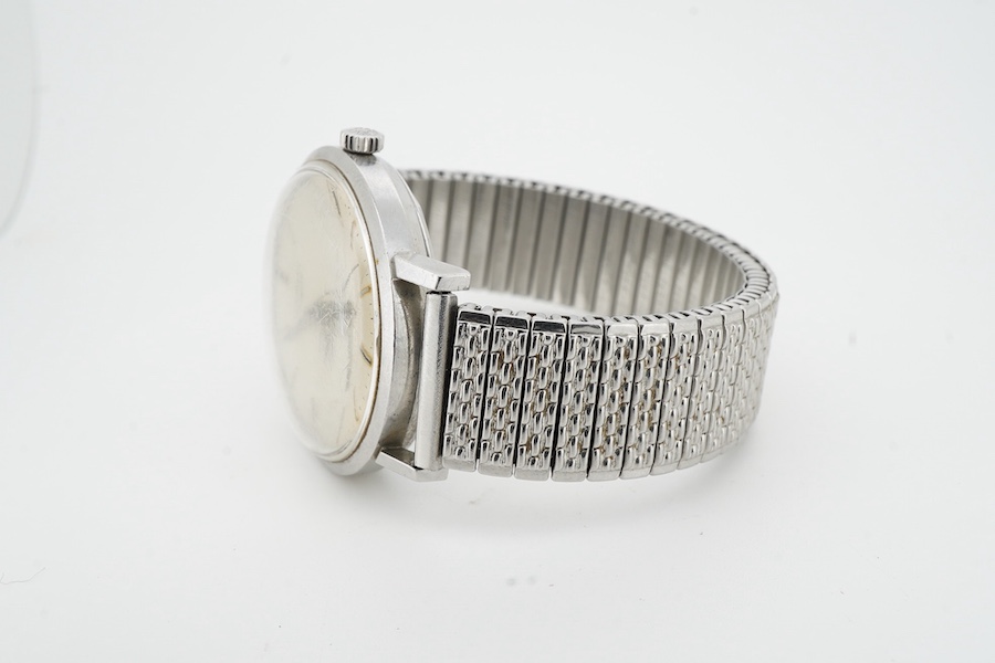 Longines, a stainless steel automatic wristwatch, ref.7844-3, 1960s, circular brushed silvered dial with baton indicators and date wheel aperture, dial and movement signed Longines, case back interior signed Longines, nu